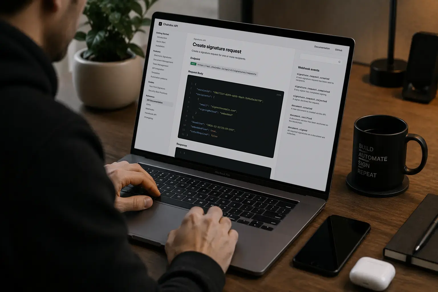 eSignature API documentation open on a laptop, showing a create-request endpoint and a list of webhook events