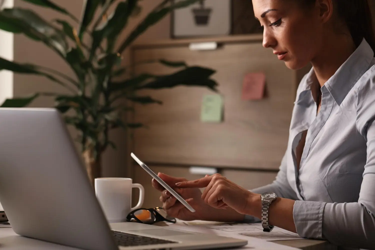 Remote professional using mobile device for secure document signing with blockchain verification